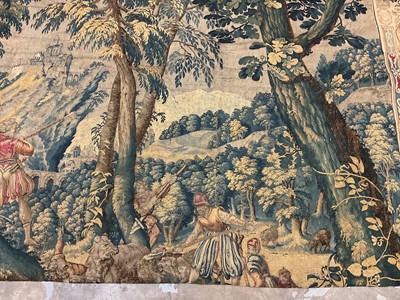 Lot 1722 - A late 16th century Flemish tapestry worked with bear hunting scenes in a mountainous forest