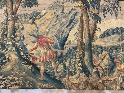 Lot 1722 - A late 16th century Flemish tapestry worked with bear hunting scenes in a mountainous forest