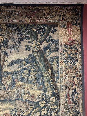 Lot 1722 - A late 16th century Flemish tapestry worked with bear hunting scenes in a mountainous forest
