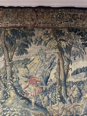 Lot 1722 - A late 16th century Flemish tapestry worked with bear hunting scenes in a mountainous forest