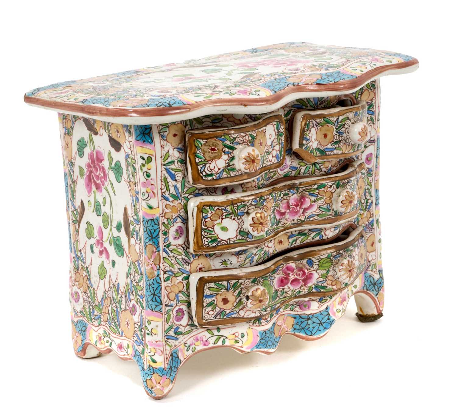 Lot 77 - Continental tin glazed miniature chest of drawers