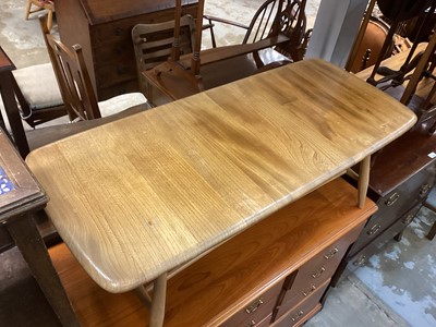 Lot 1265 - Ercol coffee table with magazine rack undertier, 105cm x 46cm x 36.5cm high