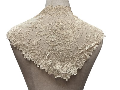 Lot 2056 - Box containing two Victorian embroidered net lace wedding bodices pointed at waistline, Mechlin lace fichu, one other lace fichu and a Honiton lace collar.