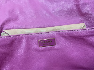 Lot 2079 - Two Prada handbags, pink canvas bag and apricot leather with pink leather lining bag. Also a black Osprey bag, pink Vera Pelle shoulder bag, silver leather bag by Dollargrand, Lulu Guiness Wild...