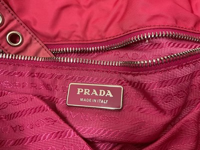 Lot 2079 - Two Prada handbags, pink canvas bag and apricot leather with pink leather lining bag. Also a black Osprey bag, pink Vera Pelle shoulder bag, silver leather bag by Dollargrand, Lulu Guiness Wild...