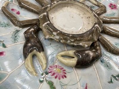 Lot 60 - 18th century Qianlong Period Chinese export porcelain Mancerina (cup stand) with a moulded crab in relief on a turquoise edged lotus leaf decorated with seaweed and flowers raised on a circular...