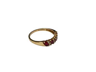 Lot 156 - 9ct gold ruby and diamond half eternity ring