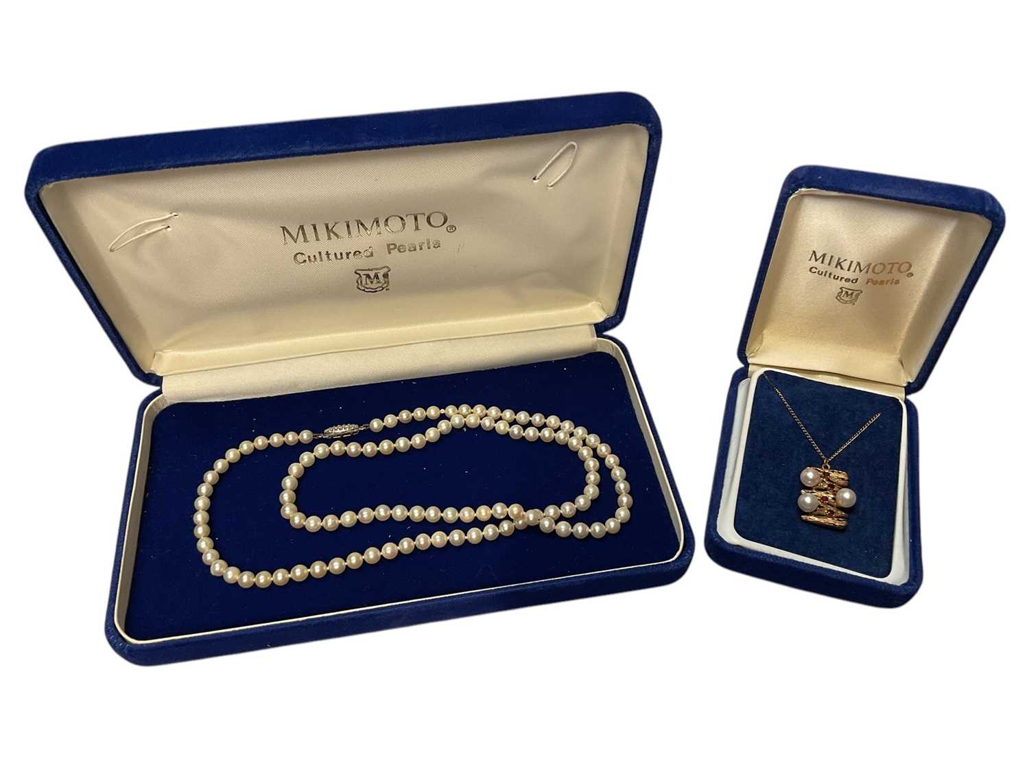 Lot 149 - Cultured pearl necklace in a Mikimoto box and a Mikimoto 9ct gold cultured pearl and garnet pendant on chain, in box