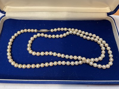 Lot 149 - Cultured pearl necklace in a Mikimoto box and a Mikimoto 9ct gold cultured pearl and garnet pendant on chain, in box