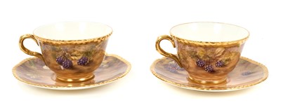 Lot 101 - Pair of Royal Worcester cabinet cups and saucers, dated 1954/55, painted with fruit, signed P. Love, the saucers 15cm diameter