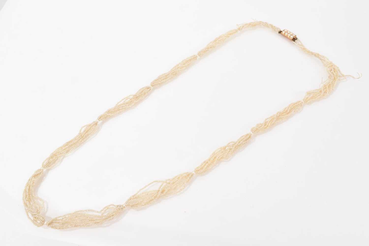 Lot 515 - 19th century seed pearl multi-strand rope twist necklace