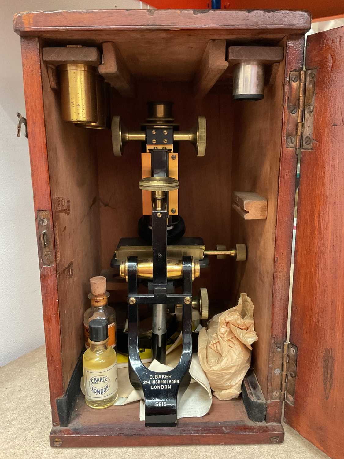 Lot 334 - Early 20th century microscope by C. Baker, 244 High Holborn, London, no. 5915, in wooden case with glass slides