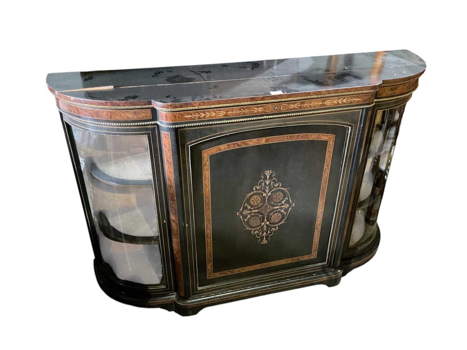 Lot 90 - 19th century ebonised and amboyna credenza with bow glass ends and central cupboard door decorated with inlay