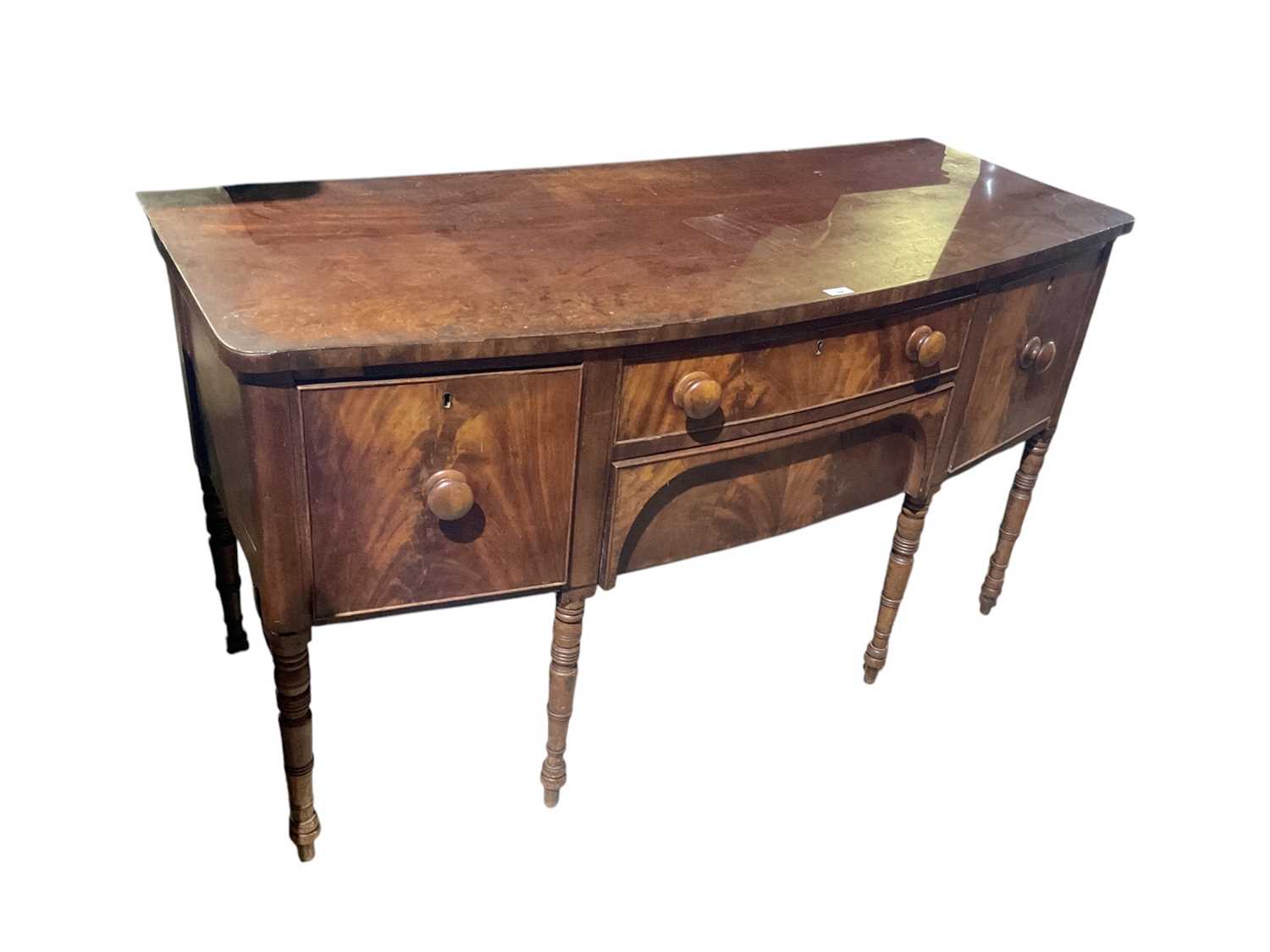 Lot 64 - Good small George III bow front sideboard standing on slender turned legs