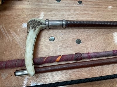 Lot 68 - Swaine & Adeney silver mounted hunting whip with horn handle and leather shaft, together with various other whips and a pair of spurs