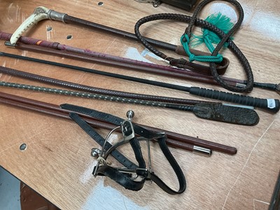 Lot 68 - Swaine & Adeney silver mounted hunting whip with horn handle and leather shaft, together with various other whips and a pair of spurs