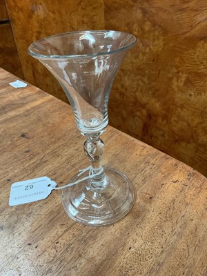 Lot 62 - Baluster wine glass, circa 1730-40, with a bell shaped bowl, on a stem with teared inverted baluster and basal knops, folded foot, 14.75cm high