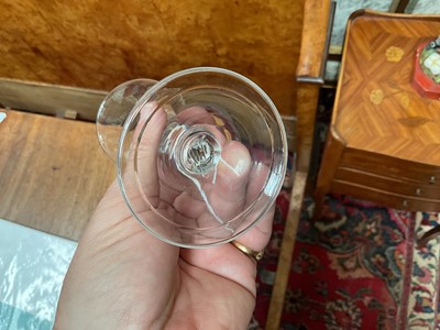 Lot 62 - Baluster wine glass, circa 1730-40, with a bell shaped bowl, on a stem with teared inverted baluster and basal knops, folded foot, 14.75cm high