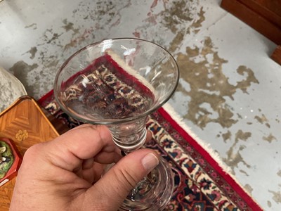 Lot 62 - Baluster wine glass, circa 1730-40, with a bell shaped bowl, on a stem with teared inverted baluster and basal knops, folded foot, 14.75cm high