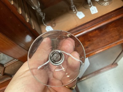Lot 63 - Three mid 18th century air twist wine glasses, including one corkscrew twist, and two multi spiral, 13.75cm to 17.75cm high (3)