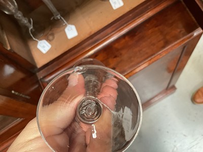 Lot 63 - Three mid 18th century air twist wine glasses, including one corkscrew twist, and two multi spiral, 13.75cm to 17.75cm high (3)