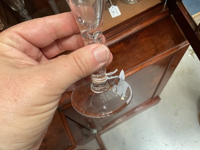 Lot 63 - Three mid 18th century air twist wine glasses, including one corkscrew twist, and two multi spiral, 13.75cm to 17.75cm high (3)