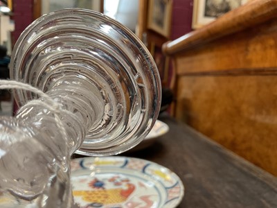 Lot 66 - 18th century firing glass, with fluted round funnel bowl, double series opaque twist stem, and stepped foot, together with another firing glass with fluted bowl and stepped foot, 10cm and 10....