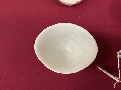 Lot 71 - Group of Chinese porcelain, including an early celadon pot and cover, blanc de chine libation cups, etc