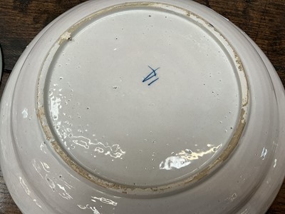 Lot 5 - Trio of 18th century Dutch delftware plates, polychrome painted in the Chinese style with parrots, the smaller two measuring 22cm and 22.5cm diameter, the larger measuring 30.5cm