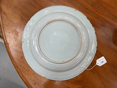 Lot 130 - Two 18th century Delft dishes, polychrome painted in the Chinese style with fence patterns, one with a bird, 35cm and 34.5cm diameter