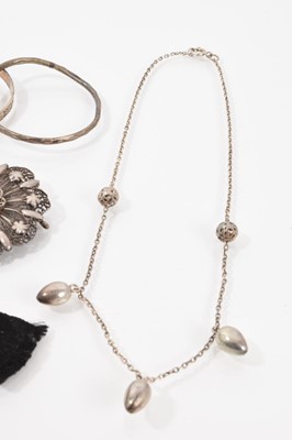 Lot 530 - Victorian white metal oval locket pendant with engraved bird decoration on chain, together with other silver and white metal jewellery