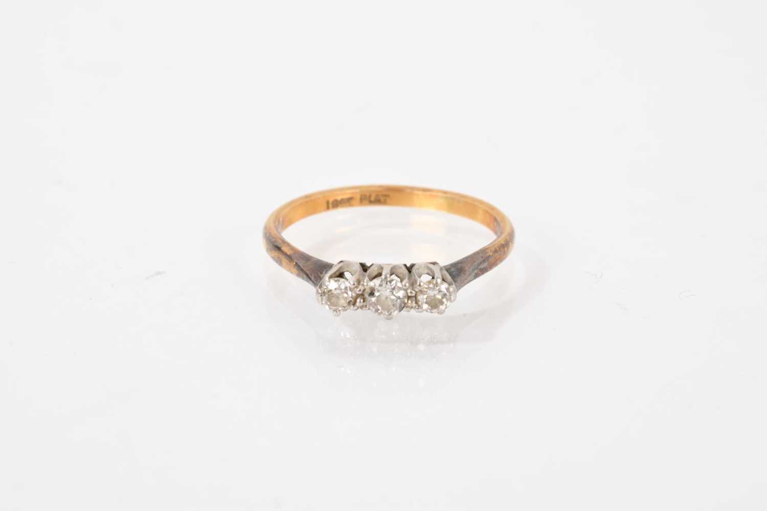 Lot 532 - Diamond three stone ring with three old cut diamonds in platinum claw setting on 18ct gold shank