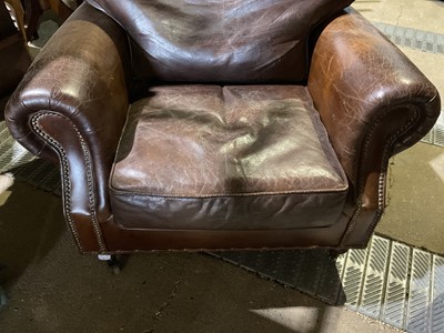 Lot 81 - Brown leather armchair with studded decoration