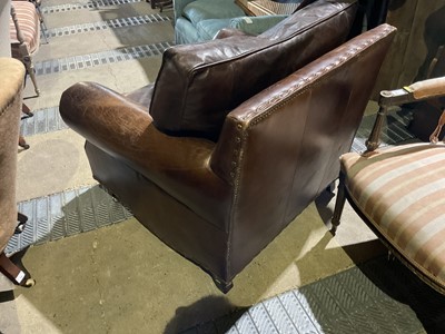 Lot 81 - Brown leather armchair with studded decoration