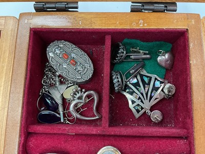 Lot 111 - Wooden jewellery box containing silver and white metal jewellery including gem set pendants and rings, earrings, green hard stone bead necklaces etc