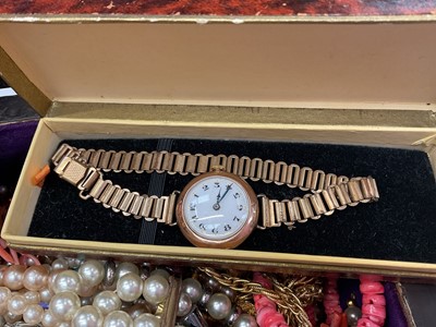 Lot 112 - Jewellery box containing vintage bead necklaces including amber, coral etc, 1920s 9ct gold cased wristwatch on plated bracelet