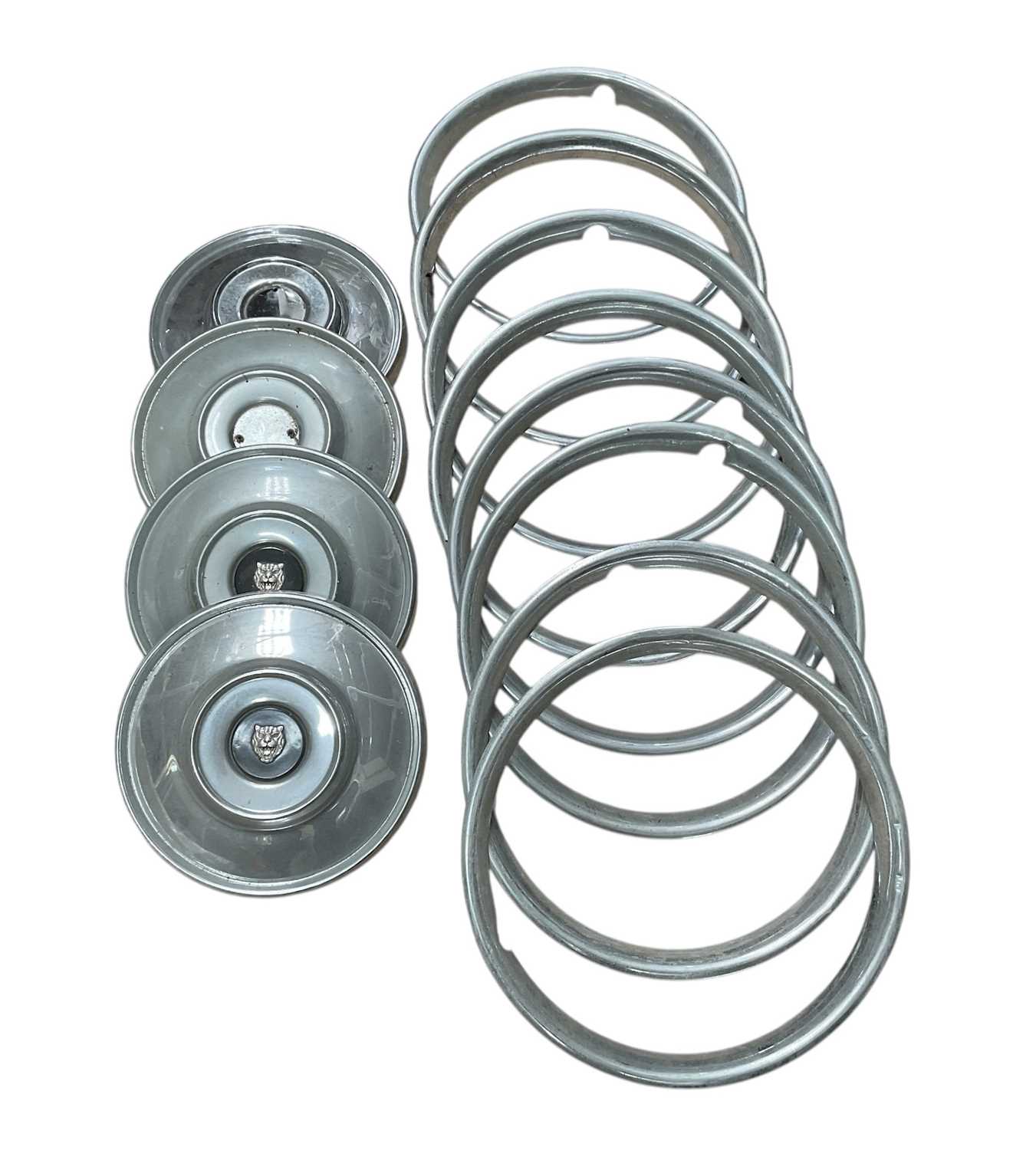 Lot 84 - Set of four Jaguar hubcaps and wheel trims.