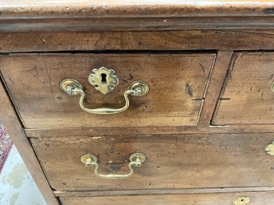 Lot 1250 - 18th century East Anglian fruitwood chest of three short and three long drawers (losses)