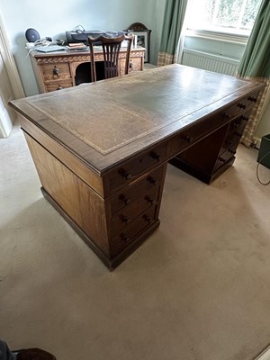 Lot 1258 - Late Victorian mahogany twin pedestal desk, the brown leather lined top above an arrangement of nine drawers with bun handles, 152cm wide x 83cm deep x 75cm high