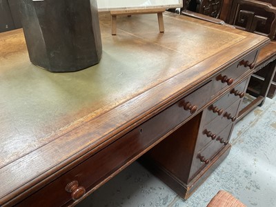 Lot 1258 - Late Victorian mahogany twin pedestal desk, the brown leather lined top above an arrangement of nine drawers with bun handles, 152cm wide x 83cm deep x 75cm high
