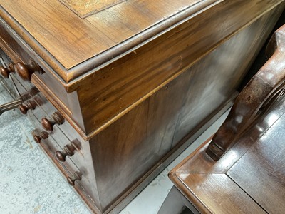Lot 1258 - Late Victorian mahogany twin pedestal desk, the brown leather lined top above an arrangement of nine drawers with bun handles, 152cm wide x 83cm deep x 75cm high