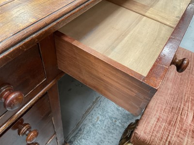 Lot 1258 - Late Victorian mahogany twin pedestal desk, the brown leather lined top above an arrangement of nine drawers with bun handles, 152cm wide x 83cm deep x 75cm high