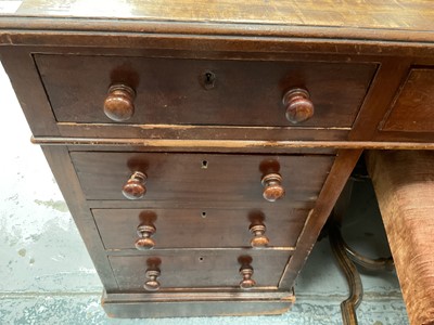 Lot 1258 - Late Victorian mahogany twin pedestal desk, the brown leather lined top above an arrangement of nine drawers with bun handles, 152cm wide x 83cm deep x 75cm high