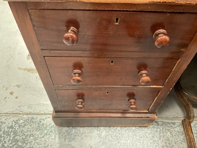 Lot 1258 - Late Victorian mahogany twin pedestal desk, the brown leather lined top above an arrangement of nine drawers with bun handles, 152cm wide x 83cm deep x 75cm high