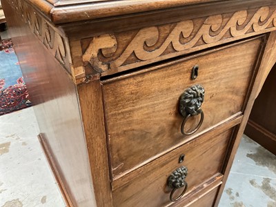 Lot 1259 - Late 19th century mahogany twin pedestal desk, the green leather lined top above an arrangement of six drawers with brass lion mask ring handles