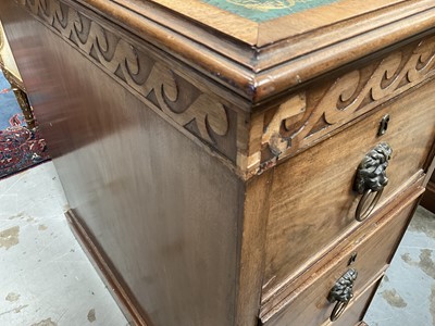 Lot 1259 - Late 19th century mahogany twin pedestal desk, the green leather lined top above an arrangement of six drawers with brass lion mask ring handles