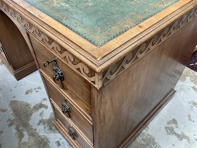 Lot 1259 - Late 19th century mahogany twin pedestal desk, the green leather lined top above an arrangement of six drawers with brass lion mask ring handles