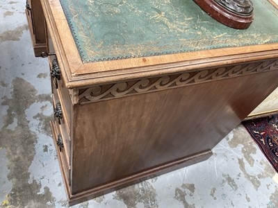 Lot 1259 - Late 19th century mahogany twin pedestal desk, the green leather lined top above an arrangement of six drawers with brass lion mask ring handles