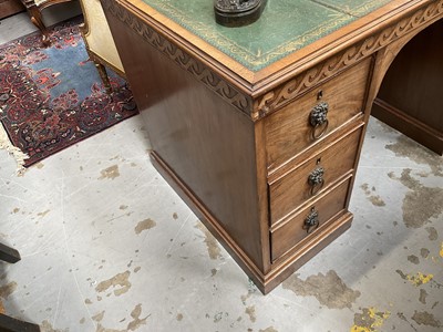 Lot 1259 - Late 19th century mahogany twin pedestal desk, the green leather lined top above an arrangement of six drawers with brass lion mask ring handles