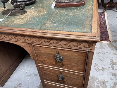 Lot 1259 - Late 19th century mahogany twin pedestal desk, the green leather lined top above an arrangement of six drawers with brass lion mask ring handles